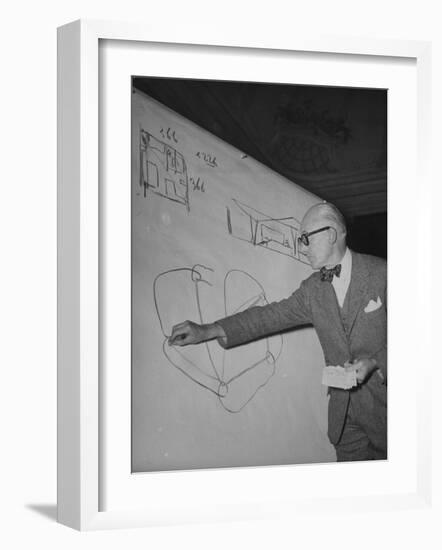 Swiss Architect Le Corbusier Standing on Stage with Notes in His Hand and Drawing on Sketch Pad-null-Framed Photographic Print