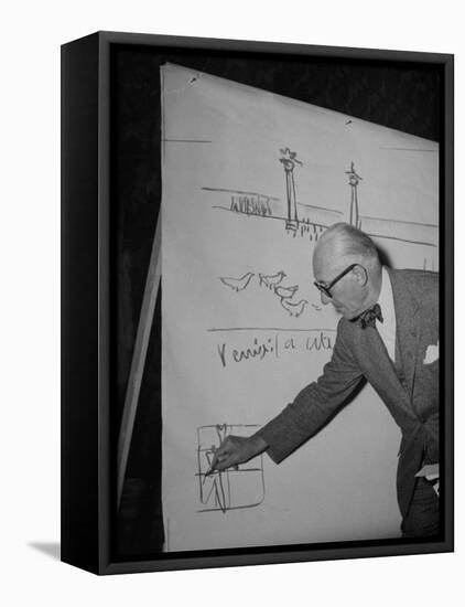 Swiss Architect Le Corbusier Standing on Stage with Notes in His Hand and Drawing on Sketch Pad-null-Framed Premier Image Canvas