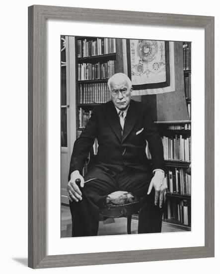 Swiss Psychiatrist Dr. Carl Jung Holding Pipe as He Sits on Chair in His Library at Home-Dmitri Kessel-Framed Premium Photographic Print