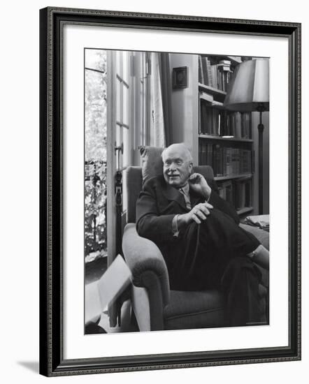 Swiss Psychiatrist Dr. Carl Jung Relaxing in an Easy Chair in His Library at Home-Dmitri Kessel-Framed Premium Photographic Print