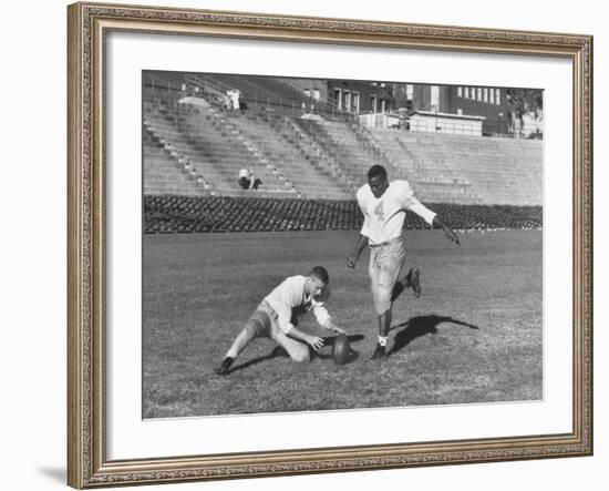 Syracuse Football Player Chuck Zimmerman Holding the Ball to Be Kicked by Teammate Jim Brown-Peter Stackpole-Framed Premium Photographic Print