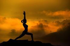 Silhouette of Woman Doing Yoga Meditation During Sunrise with Natural Golden Sunlight on Mountain-szefei-Photographic Print