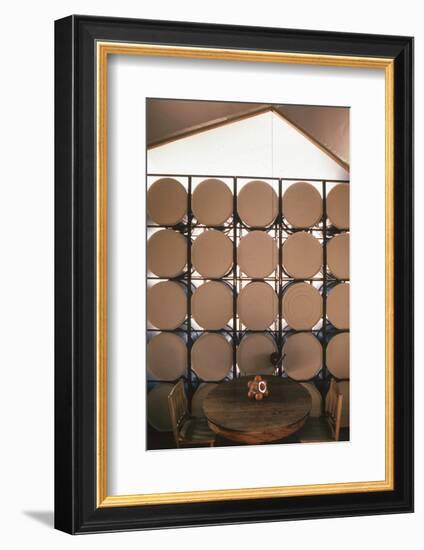 Table Againts a Stack of Barrels in a Geodesic Dome Home, Called 'Zome,' Corrales, NM, 1972-John Dominis-Framed Photographic Print