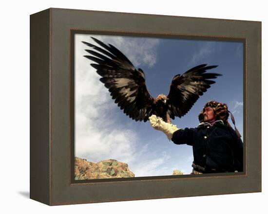 Takhuu Raising His Eagle, Golden Eagle Festival, Mongolia-Amos Nachoum-Framed Premier Image Canvas