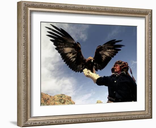 Takhuu Raising His Eagle, Golden Eagle Festival, Mongolia-Amos Nachoum-Framed Photographic Print