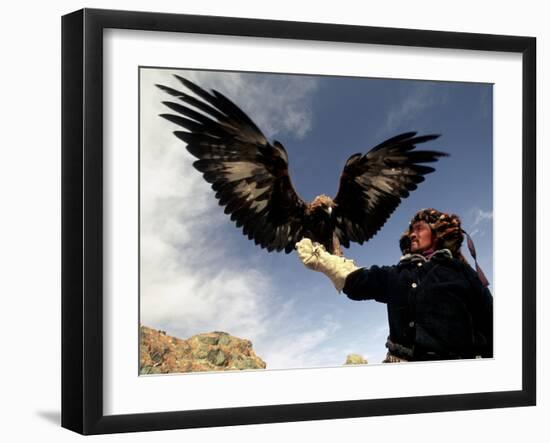 Takhuu Raising His Eagle, Golden Eagle Festival, Mongolia-Amos Nachoum-Framed Photographic Print