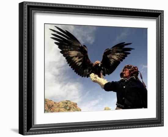 Takhuu Raising His Eagle, Golden Eagle Festival, Mongolia-Amos Nachoum-Framed Photographic Print