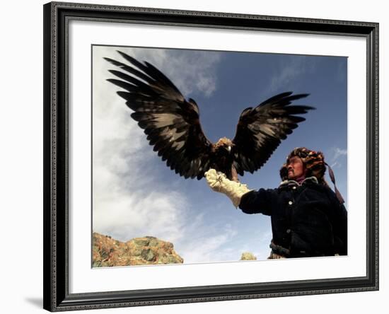 Takhuu Raising His Eagle, Golden Eagle Festival, Mongolia-Amos Nachoum-Framed Photographic Print