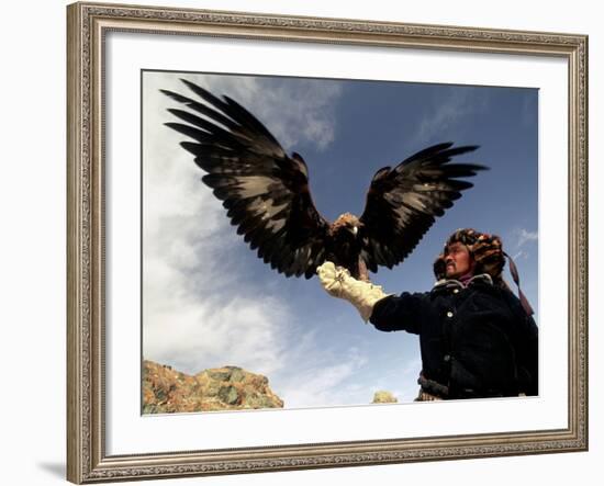 Takhuu Raising His Eagle, Golden Eagle Festival, Mongolia-Amos Nachoum-Framed Photographic Print