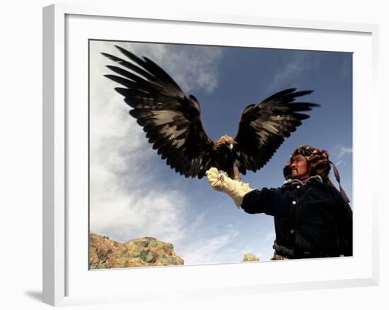 Takhuu Raising His Eagle, Golden Eagle Festival, Mongolia-Amos Nachoum-Framed Photographic Print