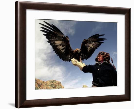 Takhuu Raising His Eagle, Golden Eagle Festival, Mongolia-Amos Nachoum-Framed Photographic Print