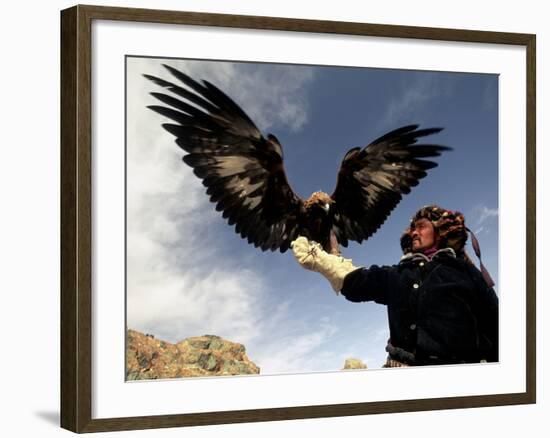 Takhuu Raising His Eagle, Golden Eagle Festival, Mongolia-Amos Nachoum-Framed Photographic Print