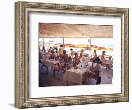 Taking Lunch in a Shaded Restaurant by the Shore in Juan Les Pins on the French Riviera, France-Ralph Crane-Framed Photographic Print