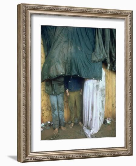 Taking Shelter from the Storm at Woodstock-Bill Eppridge-Framed Photographic Print