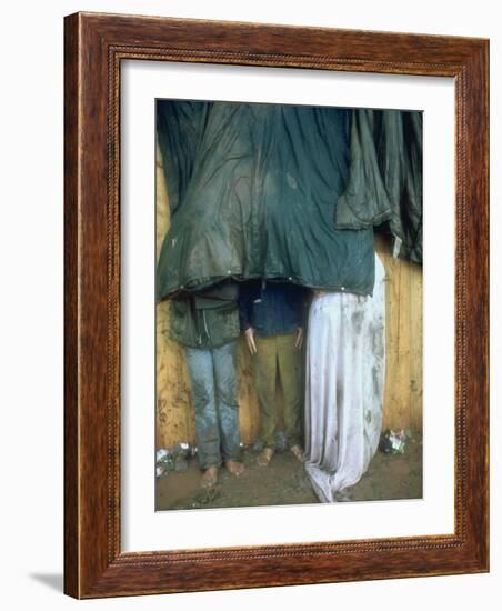 Taking Shelter from the Storm at Woodstock-Bill Eppridge-Framed Photographic Print