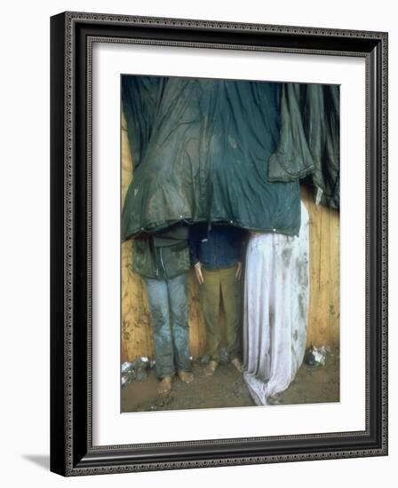 Taking Shelter from the Storm at Woodstock-Bill Eppridge-Framed Photographic Print