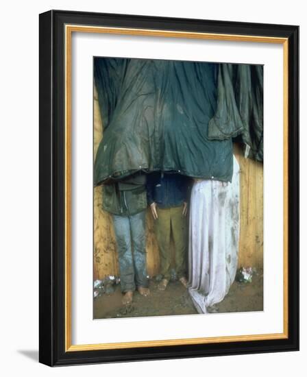 Taking Shelter from the Storm at Woodstock-Bill Eppridge-Framed Photographic Print