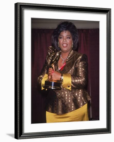 Talk Show Host Oprah Winfrey Holding Emmy Award-null-Framed Premium Photographic Print