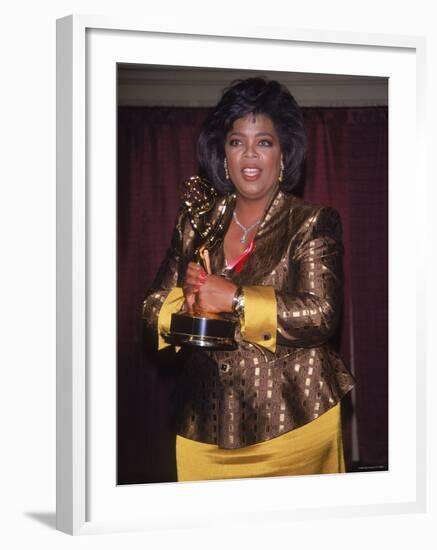 Talk Show Host Oprah Winfrey Holding Emmy Award-null-Framed Premium Photographic Print