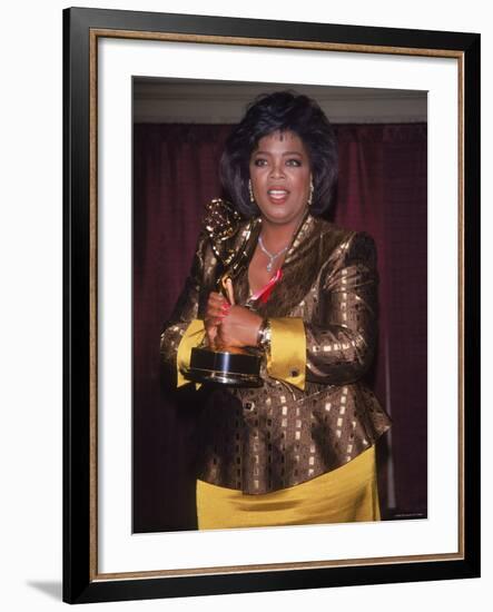Talk Show Host Oprah Winfrey Holding Emmy Award-null-Framed Premium Photographic Print