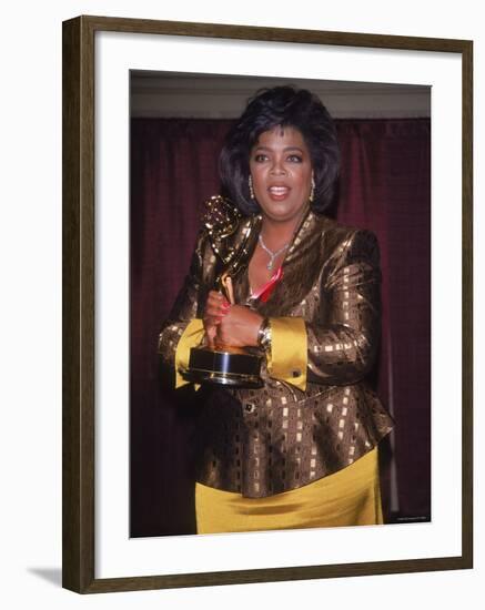 Talk Show Host Oprah Winfrey Holding Emmy Award-null-Framed Premium Photographic Print