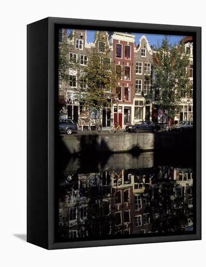 Tall Traditional Style Houses Reflected in the Water of a Canal, Amsterdam, the Netherlands-Richard Nebesky-Framed Premier Image Canvas