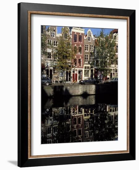 Tall Traditional Style Houses Reflected in the Water of a Canal, Amsterdam, the Netherlands-Richard Nebesky-Framed Photographic Print