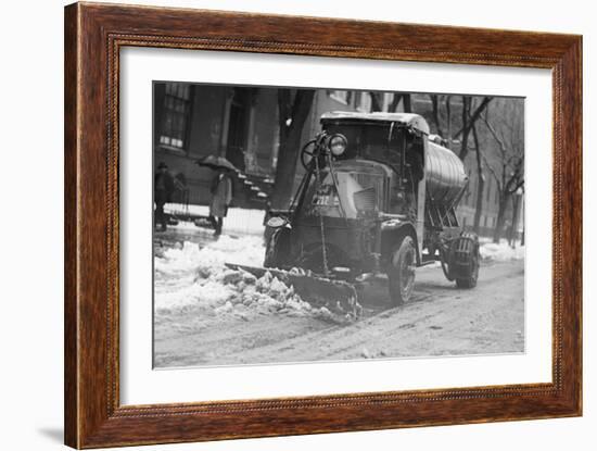 Tank Truck with Snow Plow Cleans the Streets-null-Framed Art Print