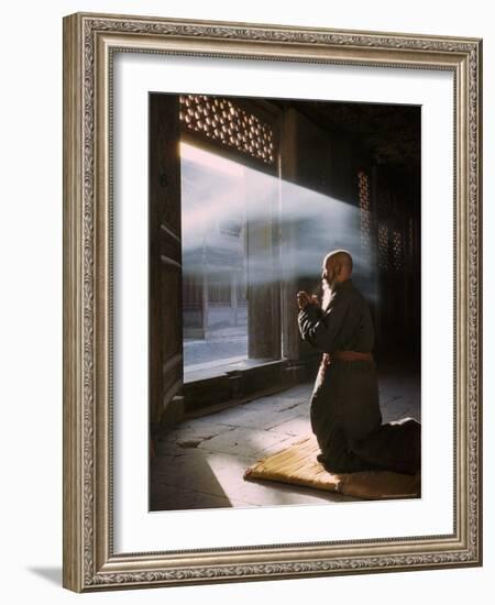 Taoist Monk in Prayer at Temple in Beijing-Dmitri Kessel-Framed Photographic Print