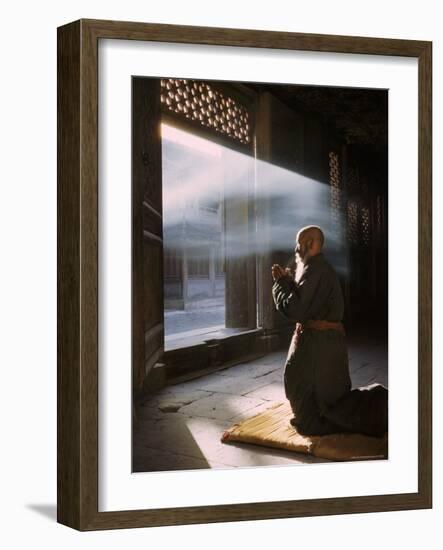 Taoist Monk in Prayer at Temple in Beijing-Dmitri Kessel-Framed Photographic Print