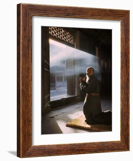 Taoist Monk in Prayer at Temple in Beijing-Dmitri Kessel-Framed Photographic Print