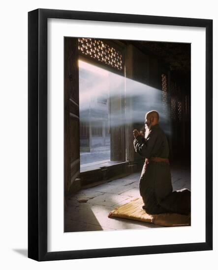 Taoist Monk in Prayer at Temple in Beijing-Dmitri Kessel-Framed Photographic Print