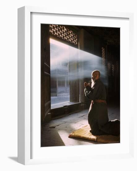 Taoist Monk in Prayer at Temple in Beijing-Dmitri Kessel-Framed Photographic Print