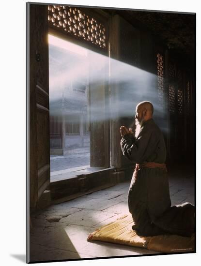 Taoist Monk in Prayer at Temple in Beijing-Dmitri Kessel-Mounted Photographic Print