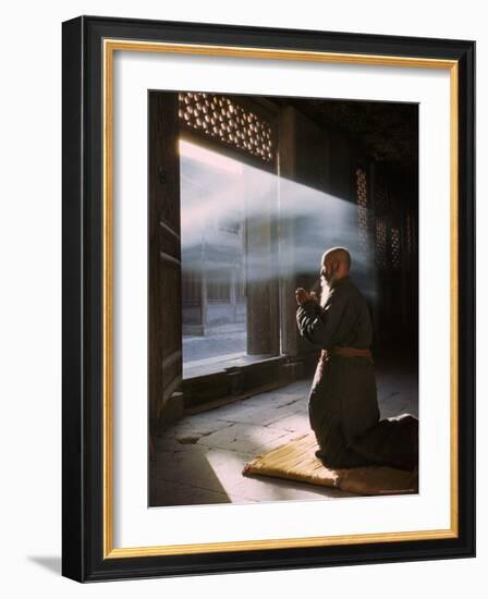 Taoist Monk in Prayer at Temple in Beijing-Dmitri Kessel-Framed Photographic Print