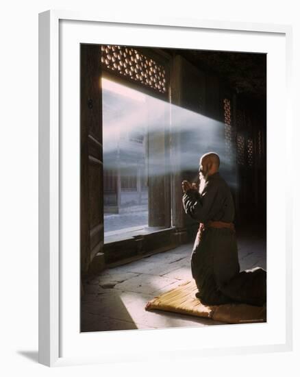 Taoist Monk in Prayer at Temple in Beijing-Dmitri Kessel-Framed Photographic Print