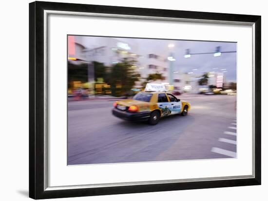 Taxi at Full Speed Early in the Evening on Collins Avenue, Miami South Beach, Florida-Axel Schmies-Framed Photographic Print