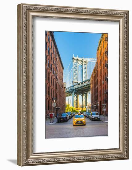 Taxi passing under the Manhattan bridge with the Empire state building framed in the bridge, New Yo-Jordan Banks-Framed Photographic Print