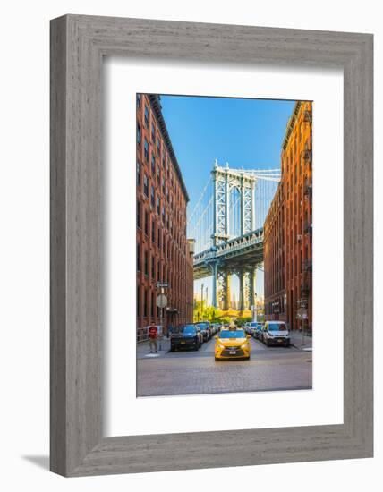 Taxi passing under the Manhattan bridge with the Empire state building framed in the bridge, New Yo-Jordan Banks-Framed Photographic Print