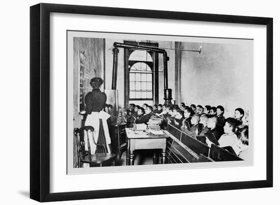 Teacher Instructs Students from Blackboard in Classroom-null-Framed Art Print