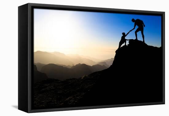 Teamwork Couple Hiking Helping Hand-blas-Framed Premier Image Canvas