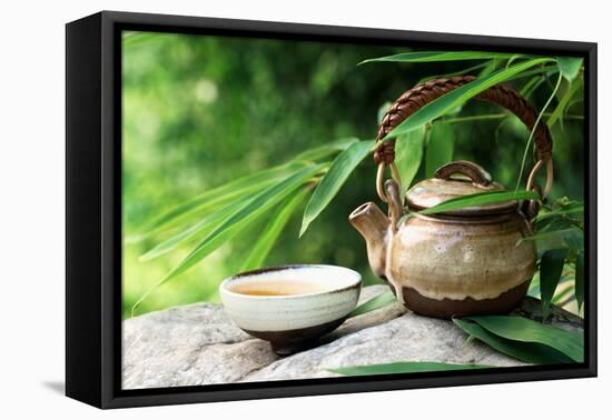 Teapot and Cups on Stone with Bamboo Leaves.-Liang Zhang-Framed Premier Image Canvas