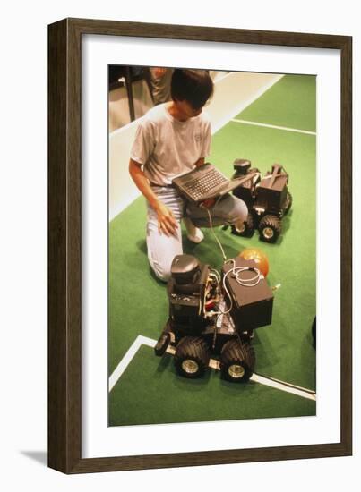 Technician Programs Robot Footballer At RoboCup-98-Volker Steger-Framed Photographic Print