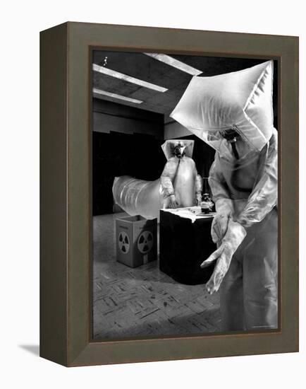 Technicians in Plastic Protective Suits and Face Masks Repair Pressure Valve at Atomic Energy Plant-Nat Farbman-Framed Premier Image Canvas