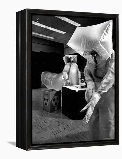 Technicians in Plastic Protective Suits and Face Masks Repair Pressure Valve at Atomic Energy Plant-Nat Farbman-Framed Premier Image Canvas