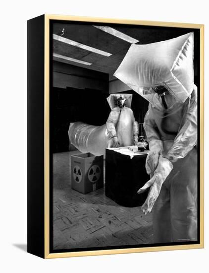 Technicians in Plastic Protective Suits and Face Masks Repair Pressure Valve at Atomic Energy Plant-Nat Farbman-Framed Premier Image Canvas