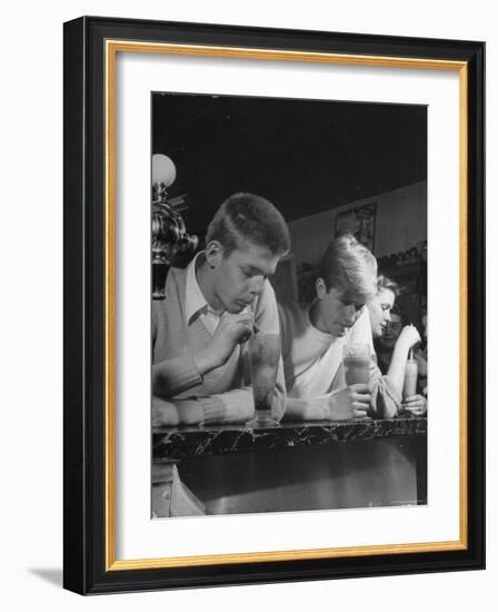 Teen Age Boys and Girls Drinking Milkshakes in Drug Store-Nina Leen-Framed Photographic Print