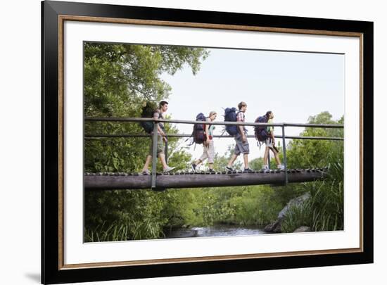 Teenage Boys and Girls with Backpacks Walking on Bridge in Forest-Nosnibor137-Framed Photographic Print