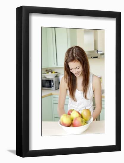 Teenage Girl Cutting Apples, Portrait, Healthy Nutrition-Axel Schmies-Framed Photographic Print