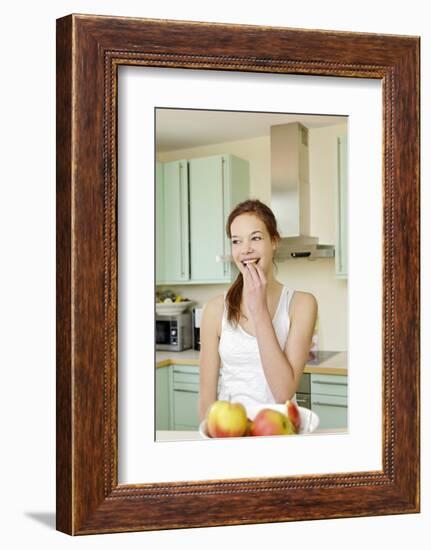 Teenage Girl Cutting Apples, Portrait, Healthy Nutrition-Axel Schmies-Framed Photographic Print